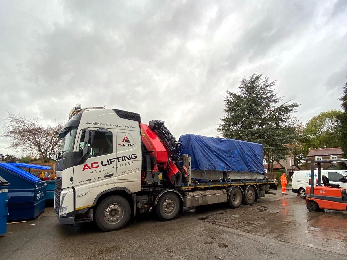 AC Lifting HIAB loaded with containers at the yard ready for delivery.