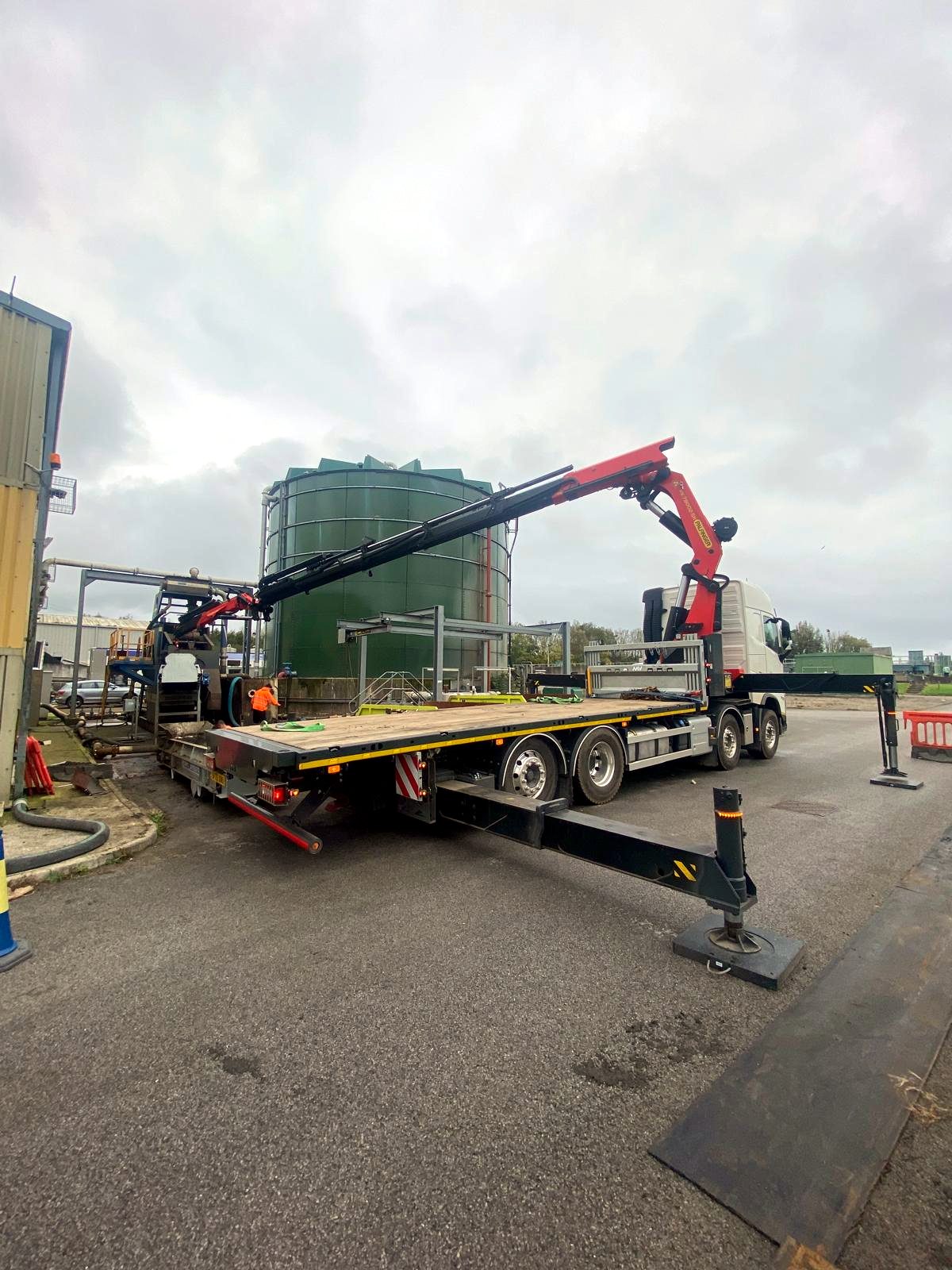 HIAB crane fully extended for a working site lift.