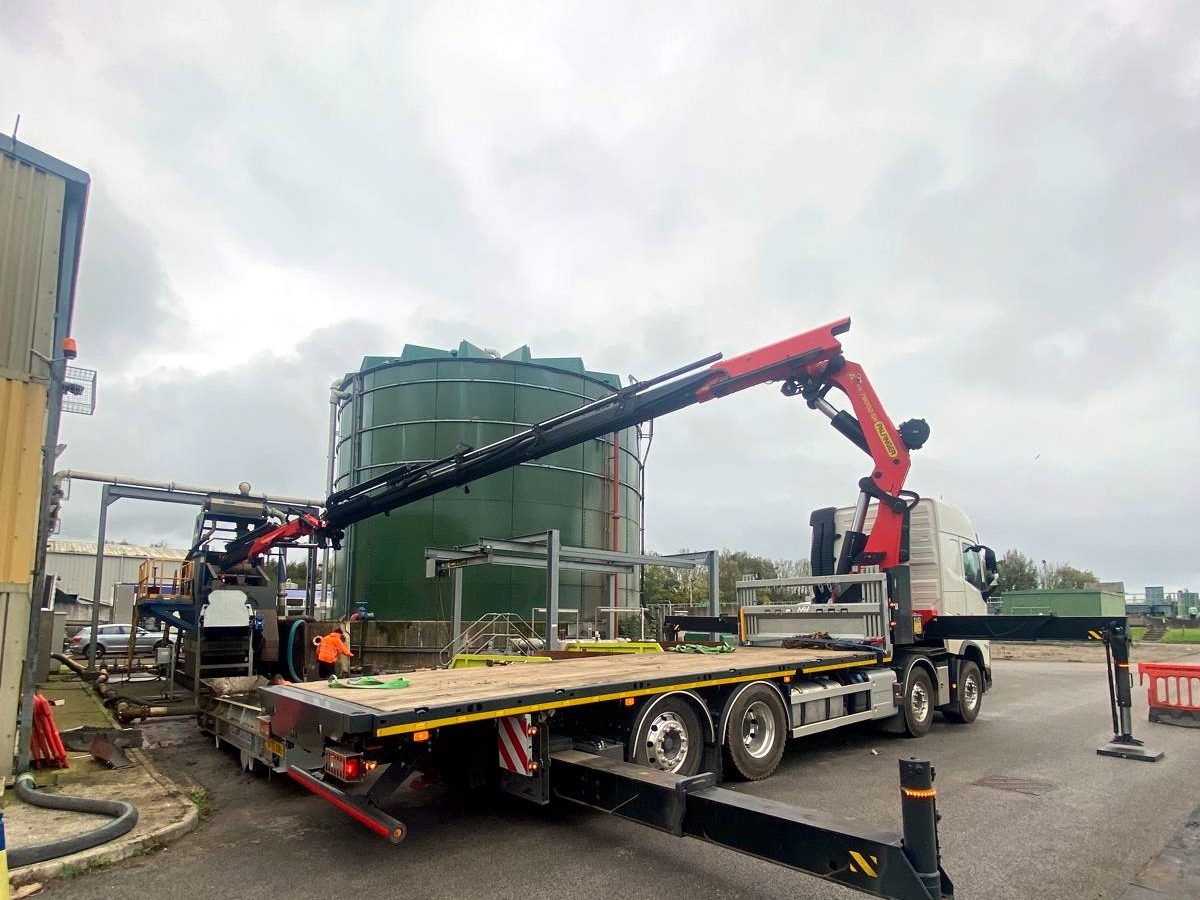 HIAB crane fully extended for a working site lift.