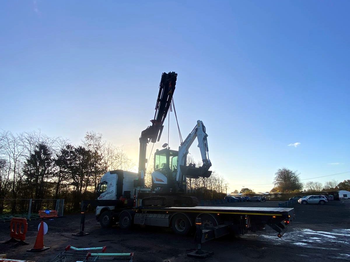 HIAB crane operating at sunset — the team works until the job is finished.