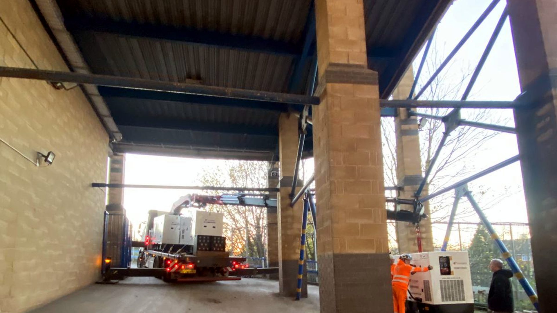 AC Lifting HIAB navigating a tight structural clearance on a delivery.