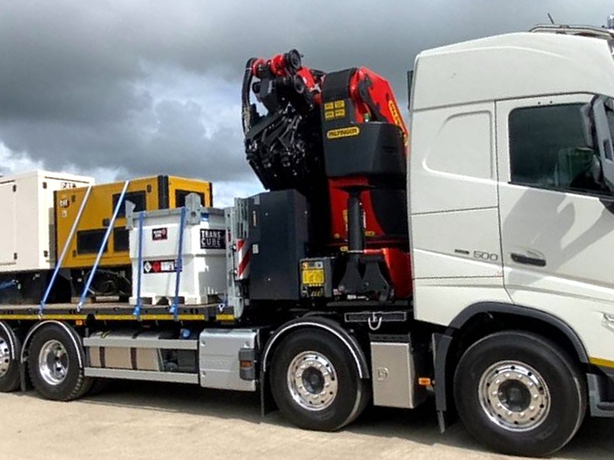 Low-loader flatbed at the AC Lifting depot, ready for heavy haulage.