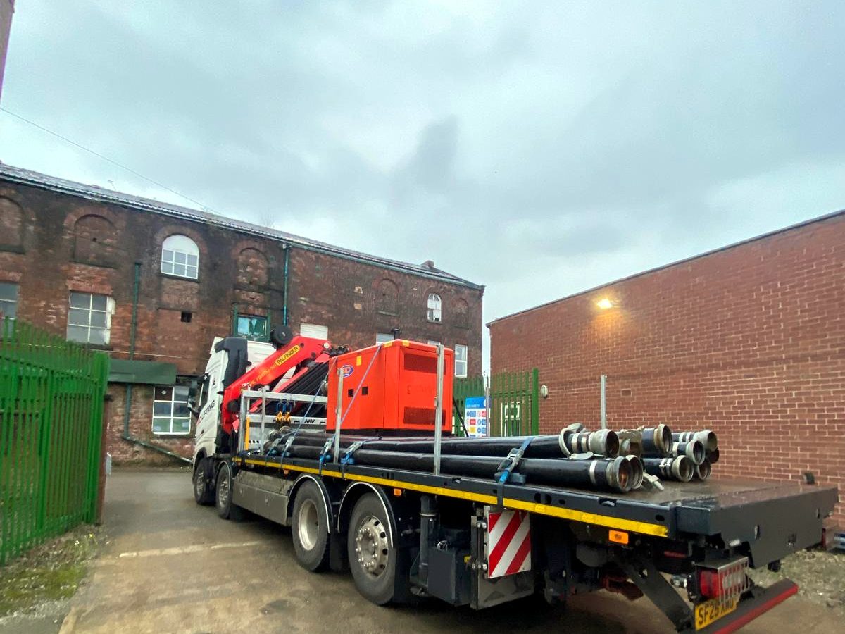 AC Lifting HIAB delivering plant and equipment at a factory site.